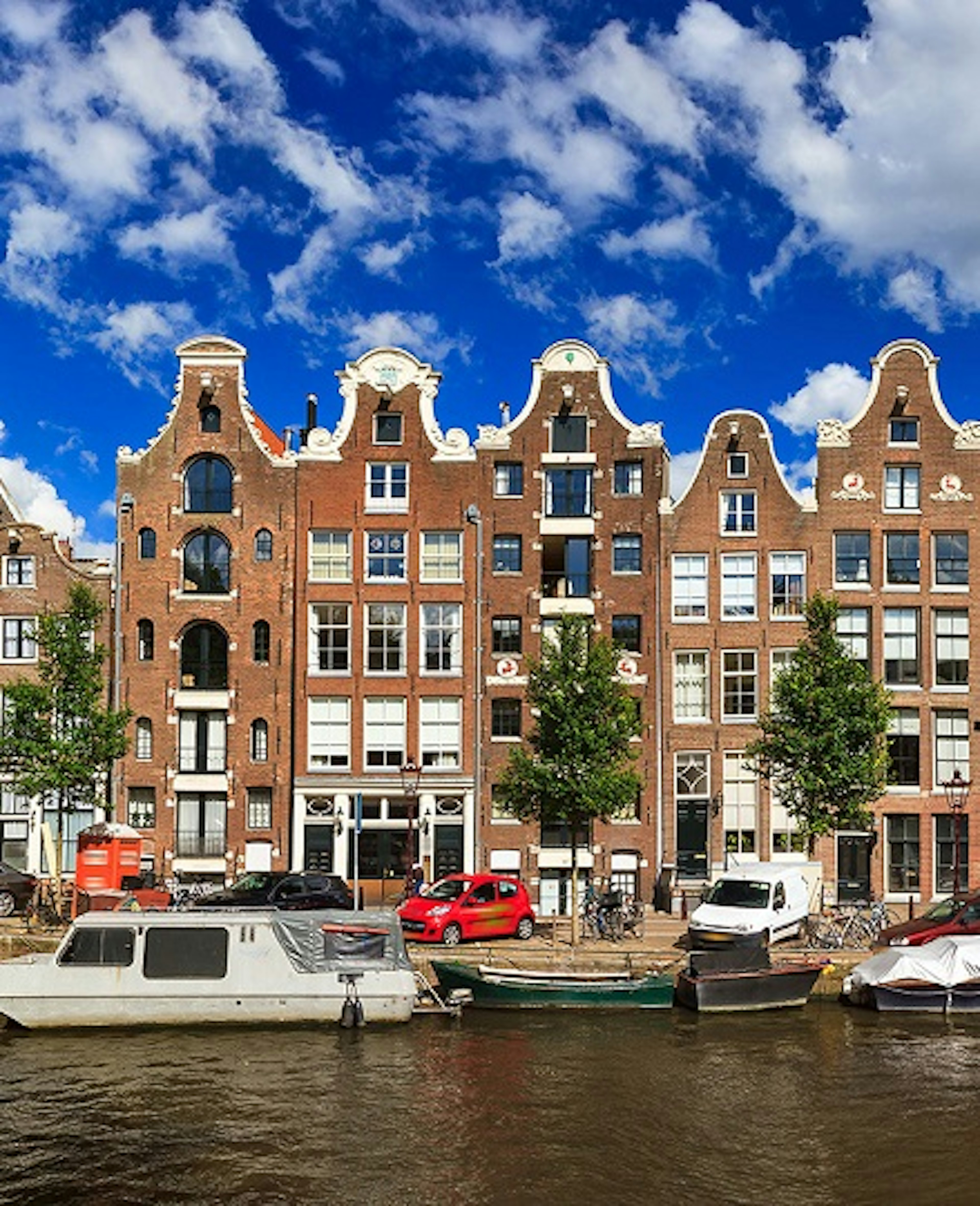 A picturesque view over the historical buildings on the banks of a canal in Amsterdam