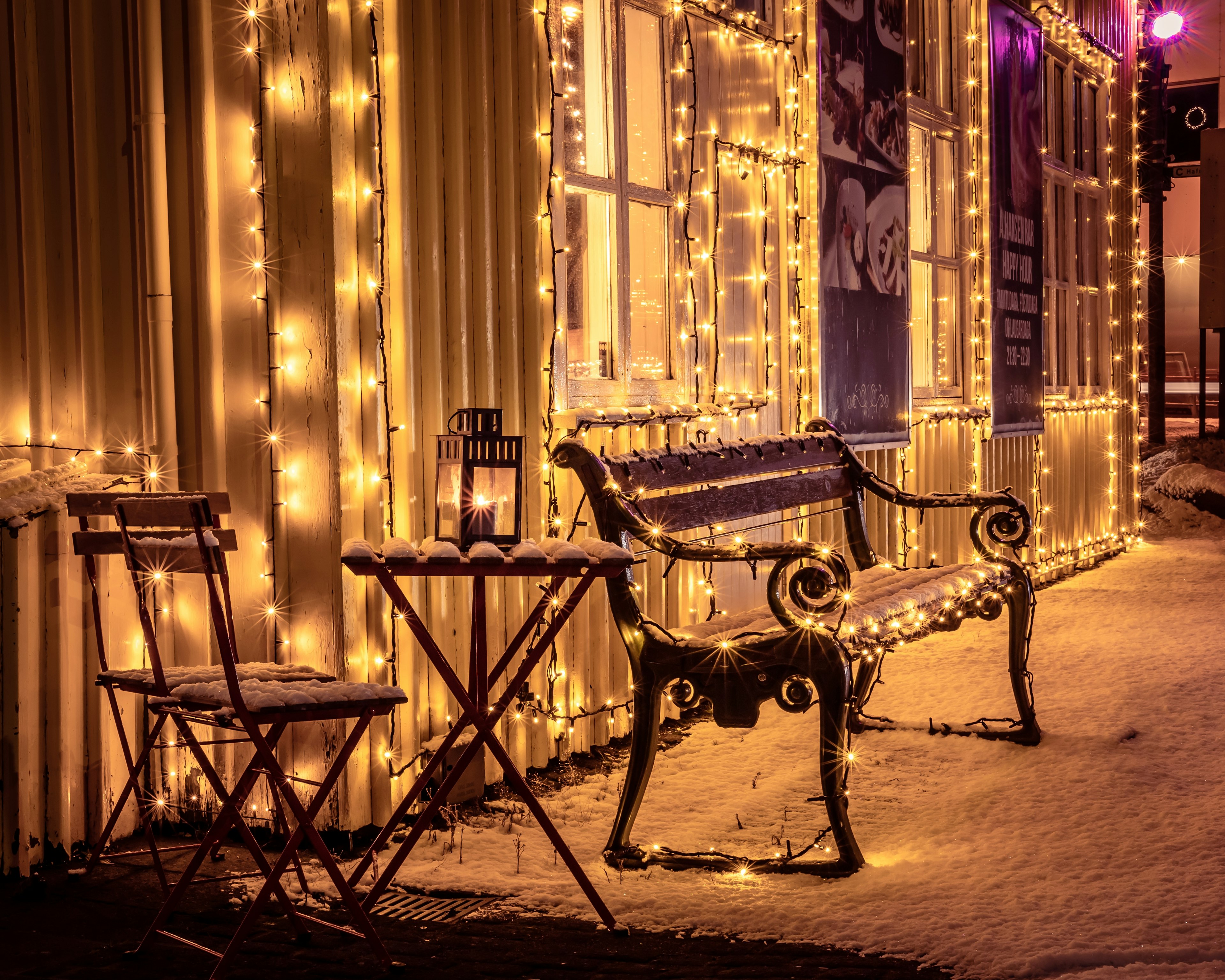 Christmas lights on a house and bench in Iceland
