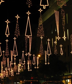 Christmas decorations hanging over a street