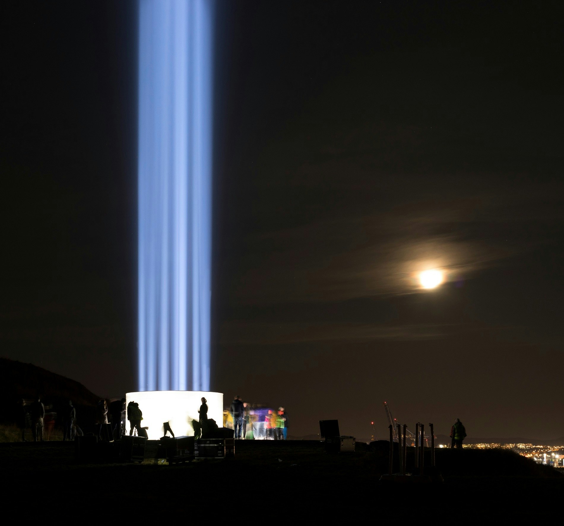 The Imagine Peace Tower in Viðey, Reykjavik with the moon in the background