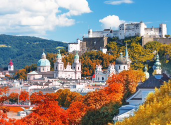 scenic summer autumn view on a city Salzburg skyline with mountains in the background
