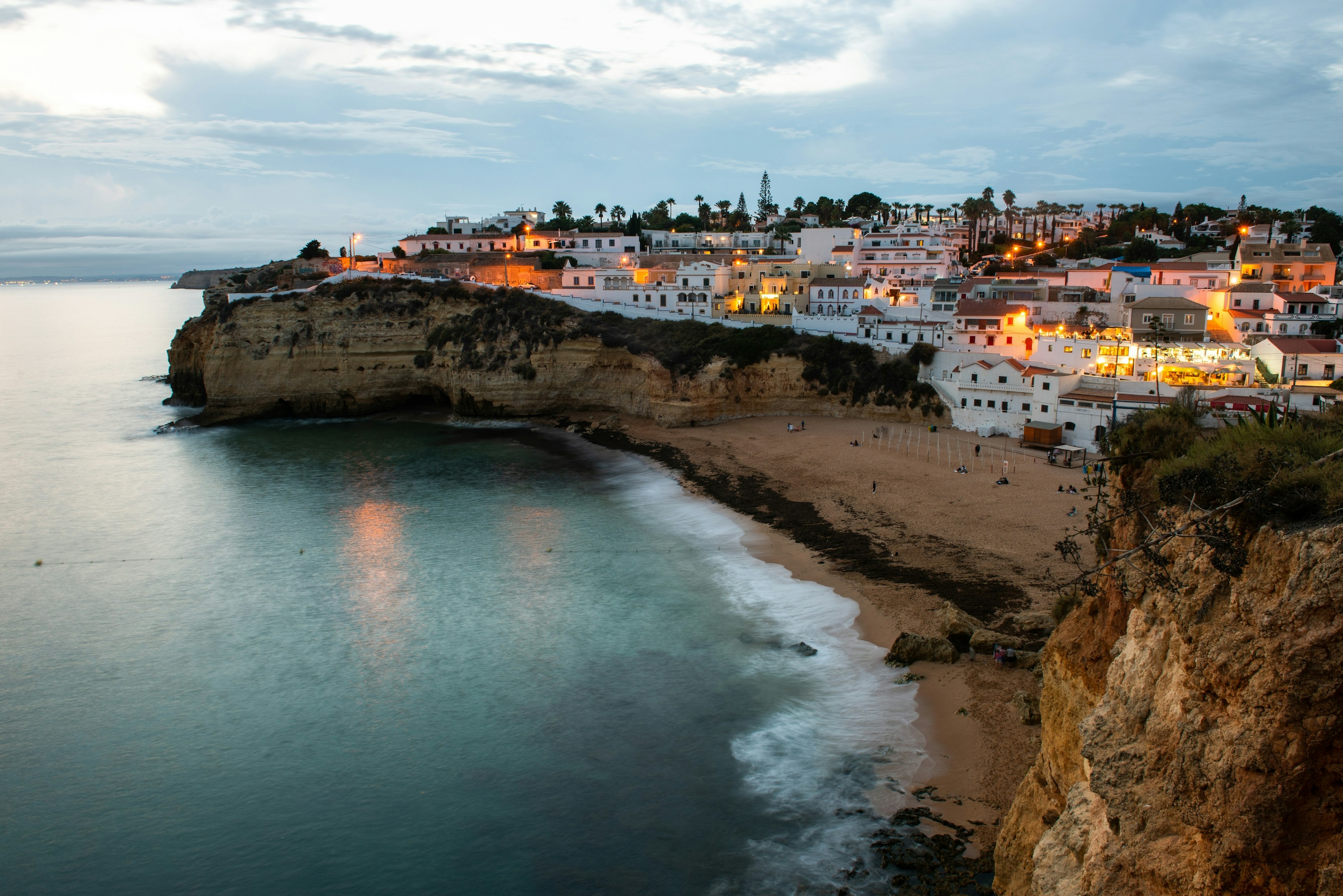 The beautiful fishing village of Carvoeiro in Algarve in Portugal at dusk.