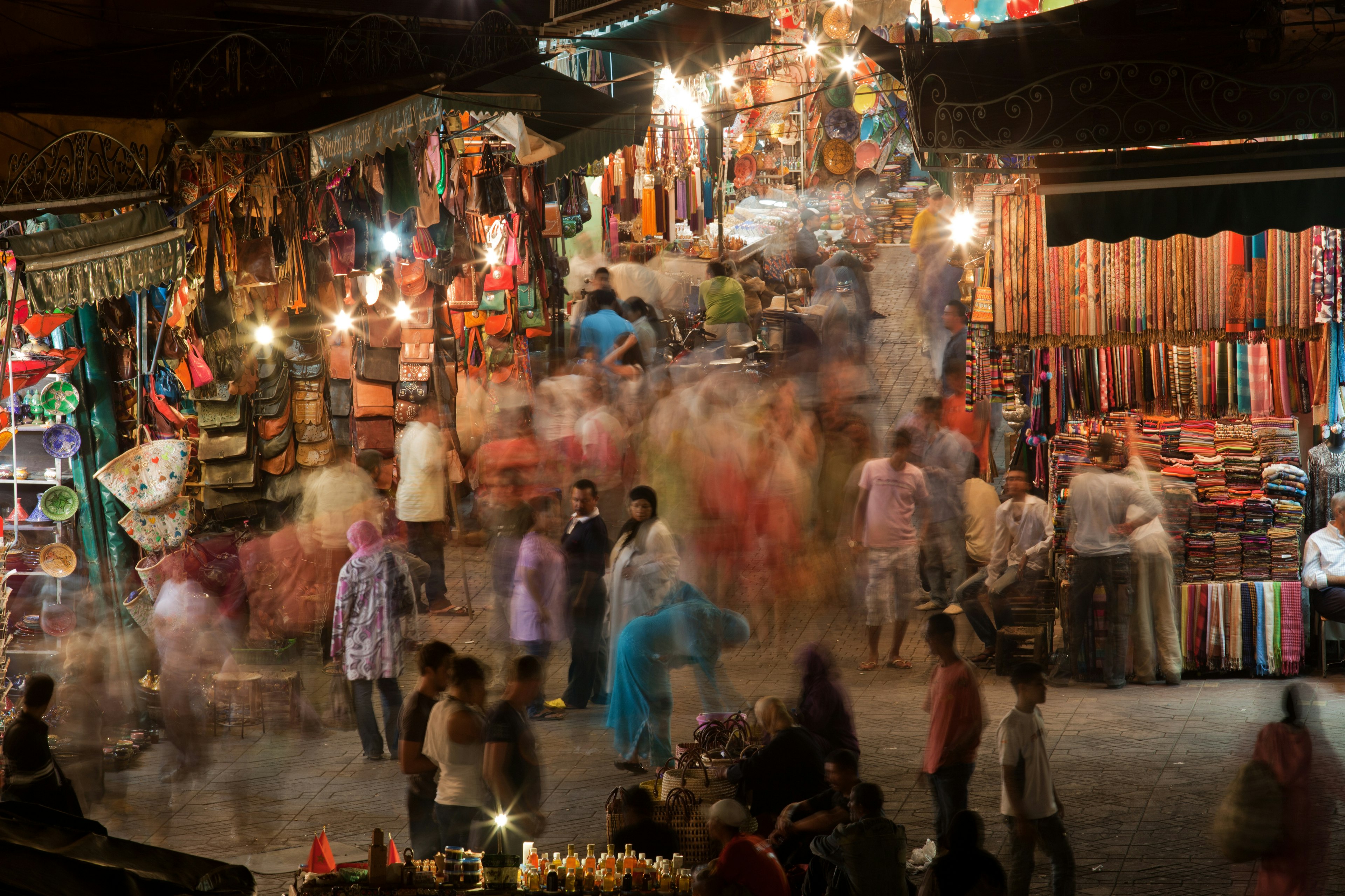 A busy market in Marrakech with a lot of people.