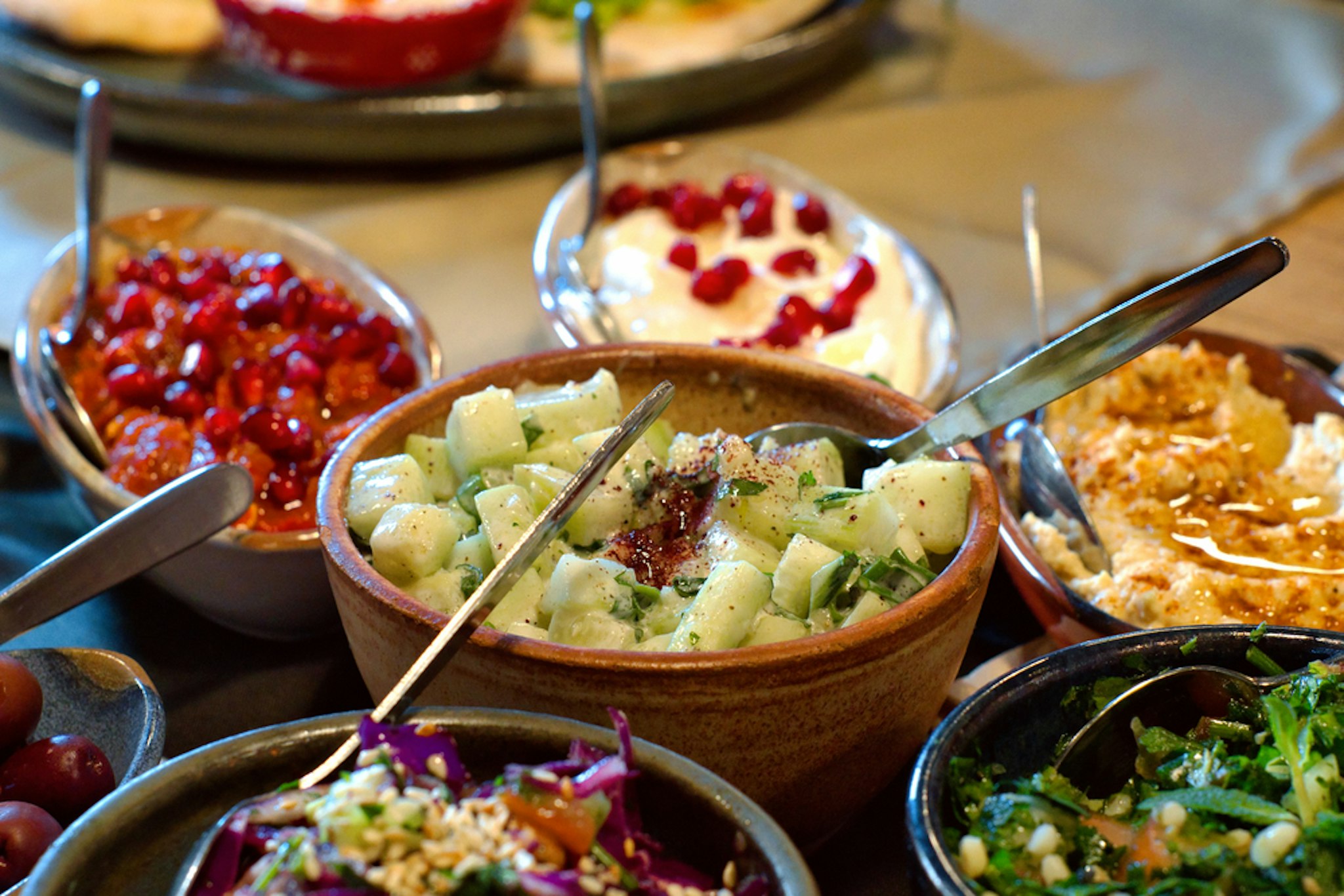 Arabic meze platter (starters) - hummus, mutabbal, babaganosh, tabbouleh, pita