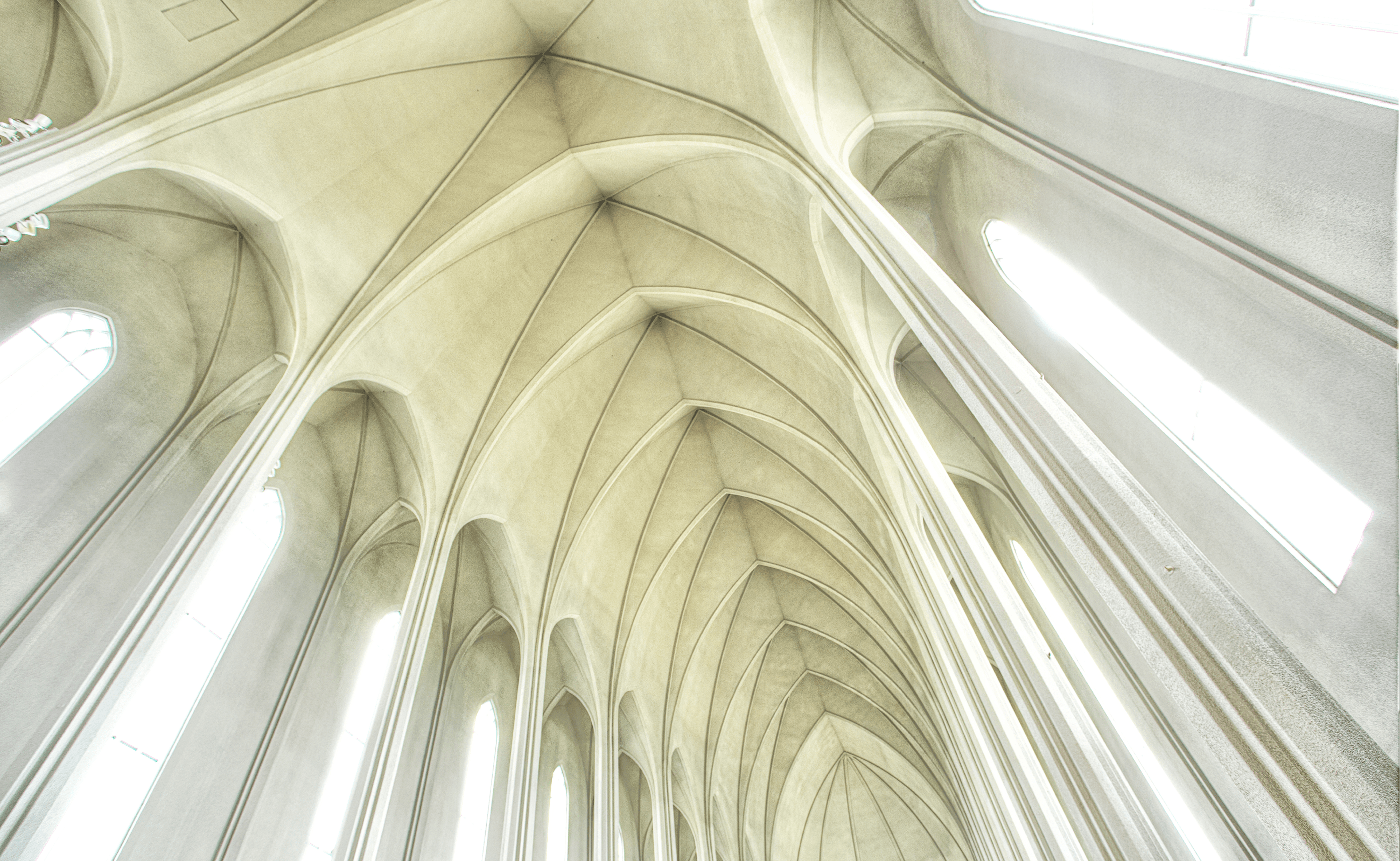 Looking up at the white domed ceiling from within Hallgrímskirkja church in Reykjavik