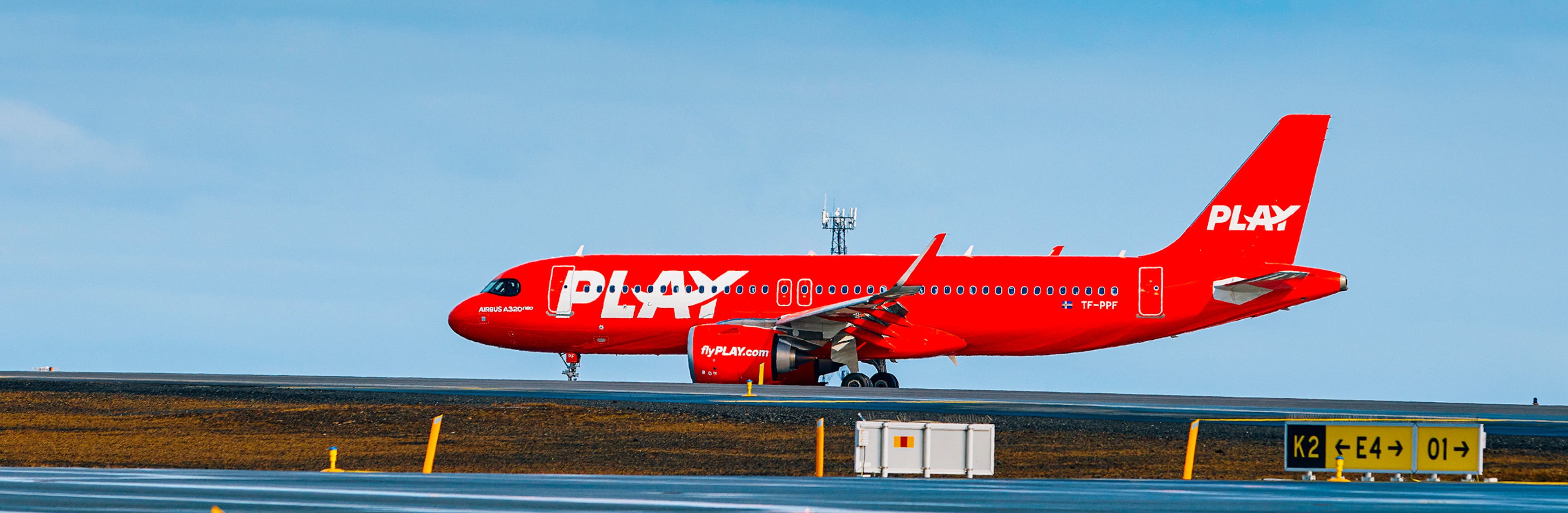 PLAY aircraft with blue sky in background