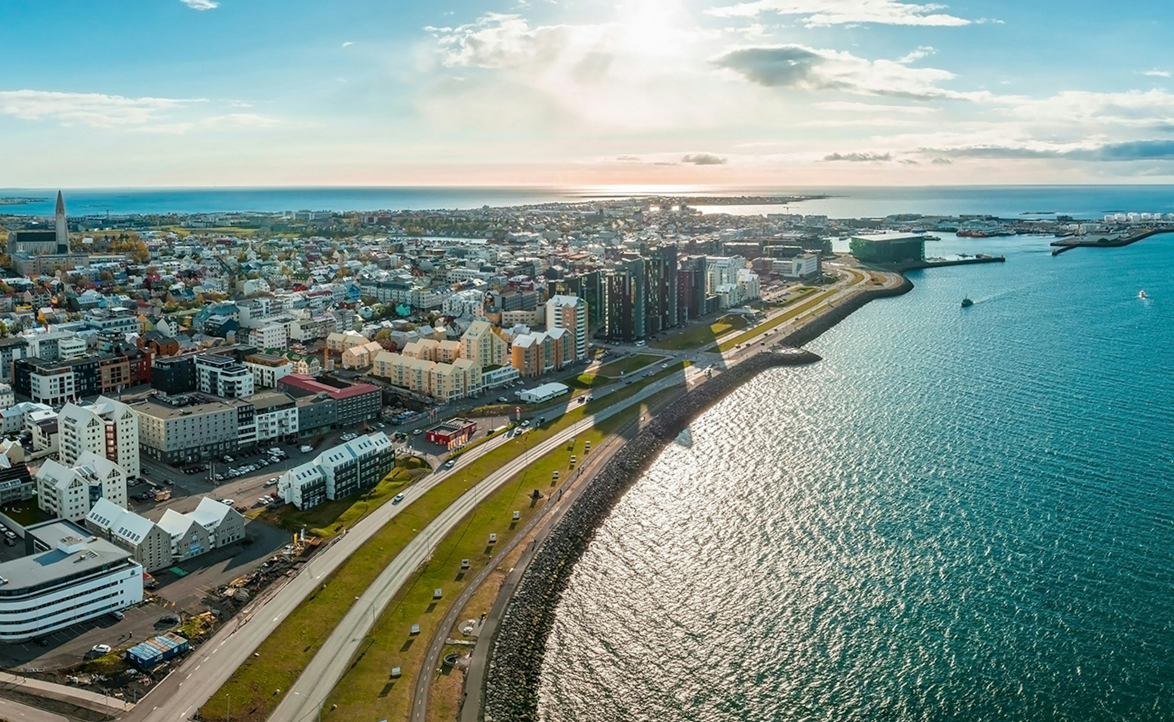 A panoramic shot of Sæbraut seafront on a sunny day in Reykjavik