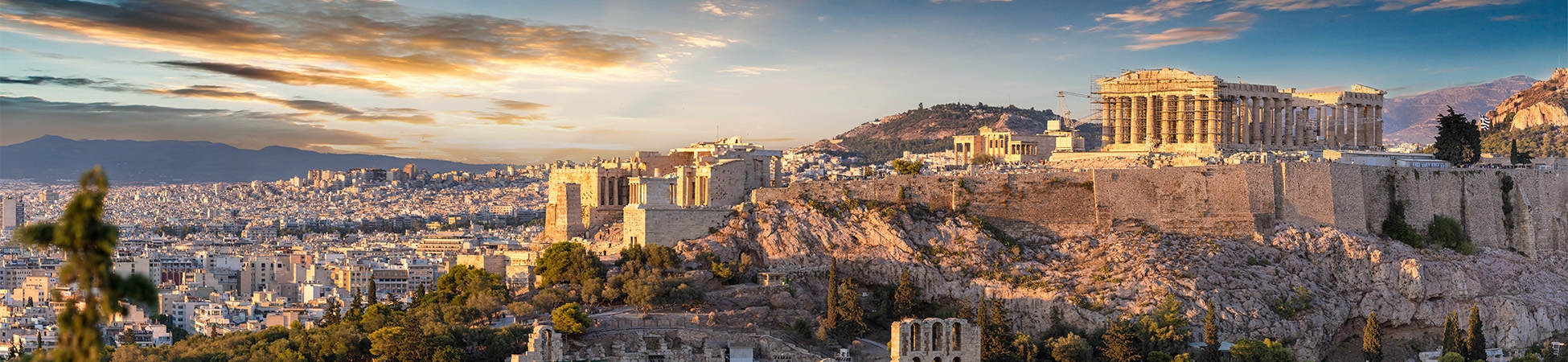 The Acropolis of Athens, Greece, with the Parthenon Temple on top of the hill during a summer sunset