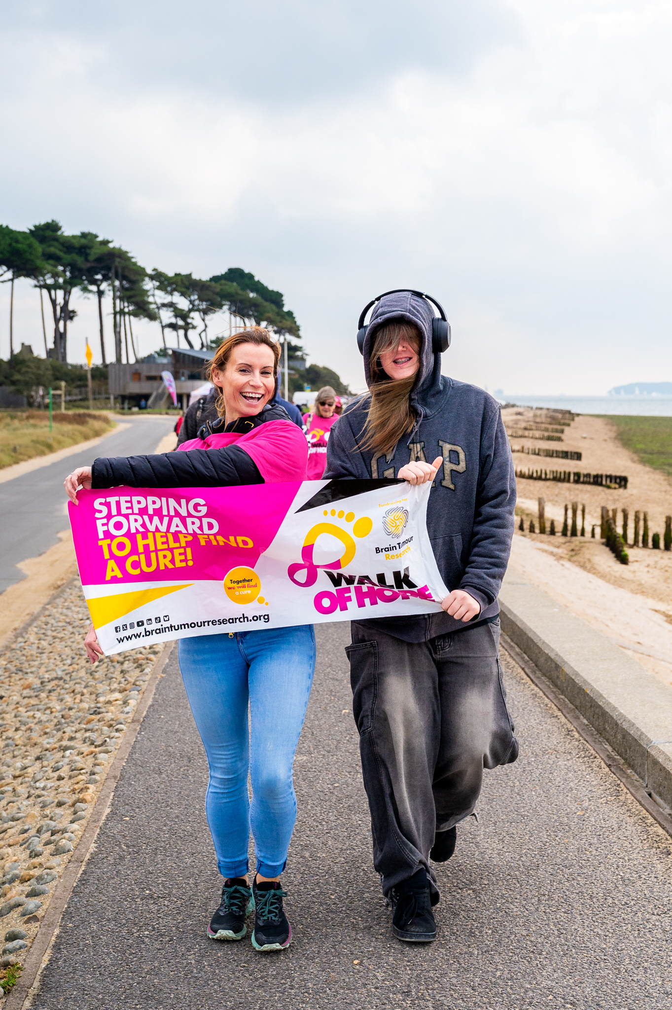 Two participants holding a Walk of Hope sign. 