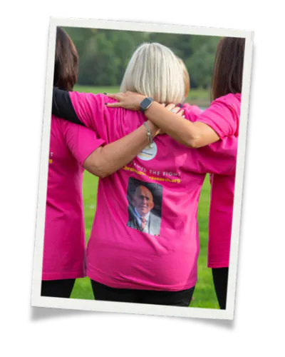 Walk participant with a memorial photo on the back of their t-shirt.