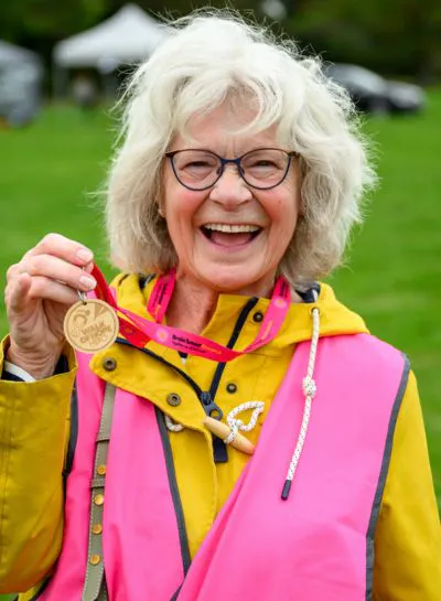 Walk of Hope participant smiling with medal