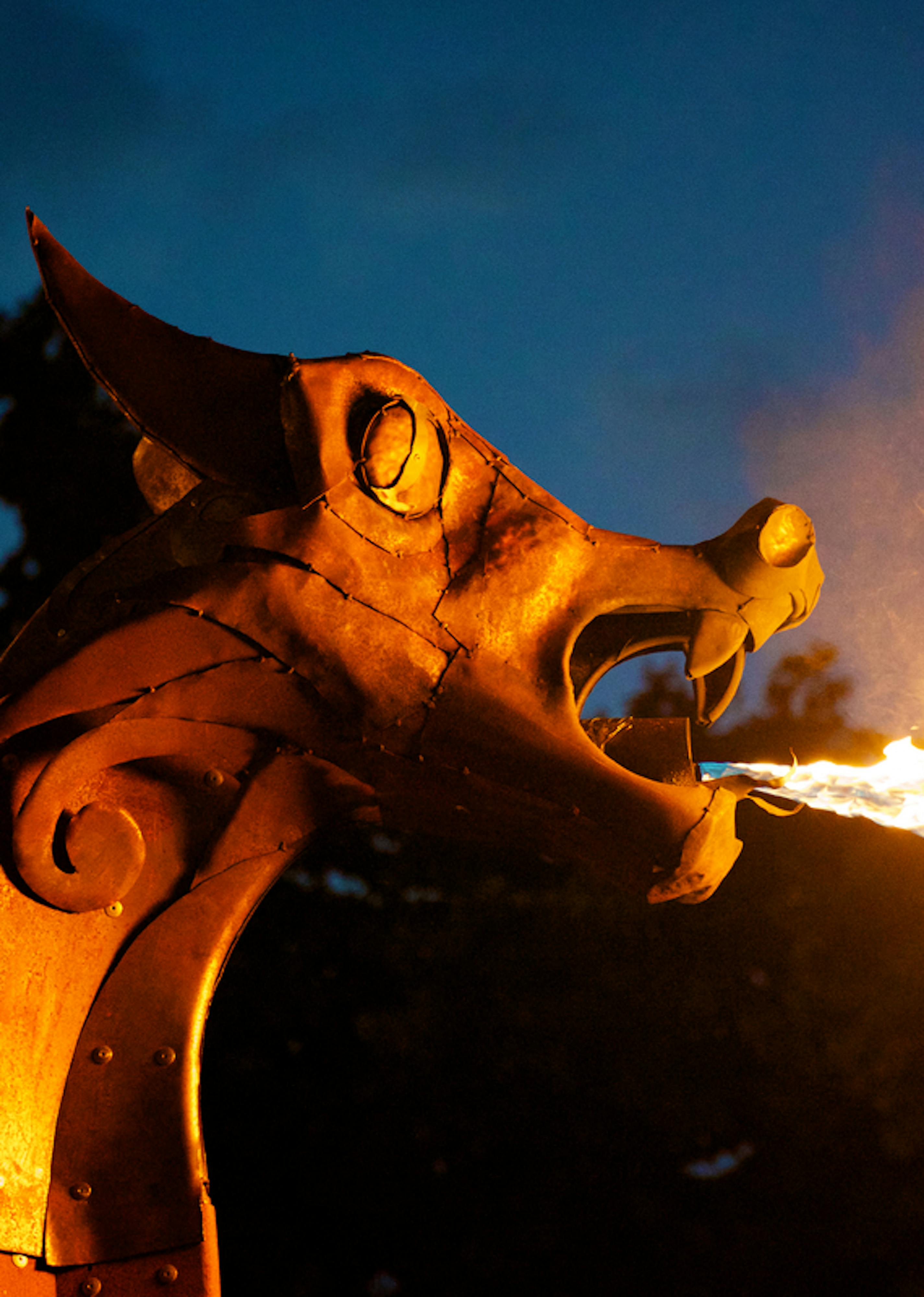 The dragon head from the front of a ship breathing fire