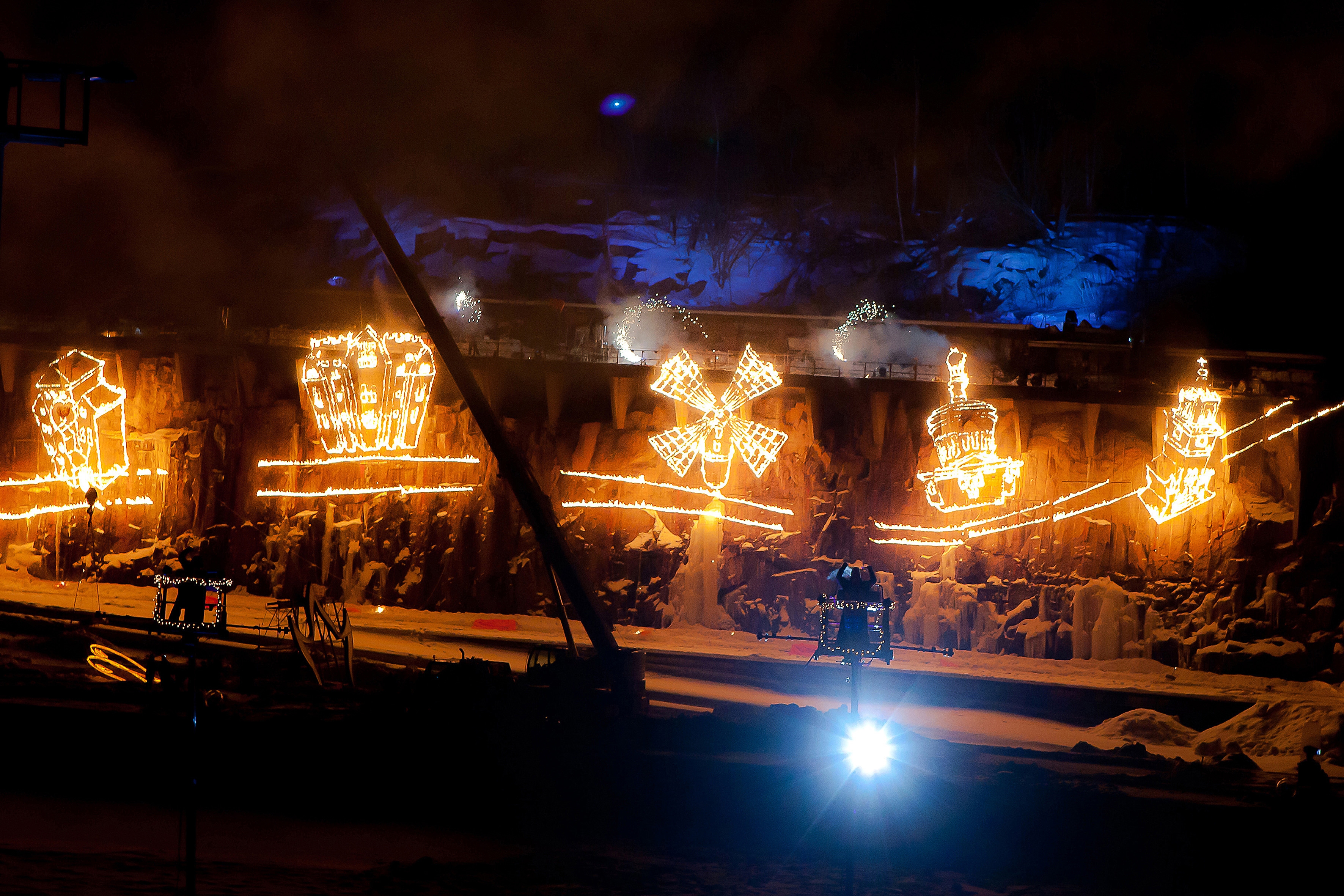 A giant fire drawing on stage burning