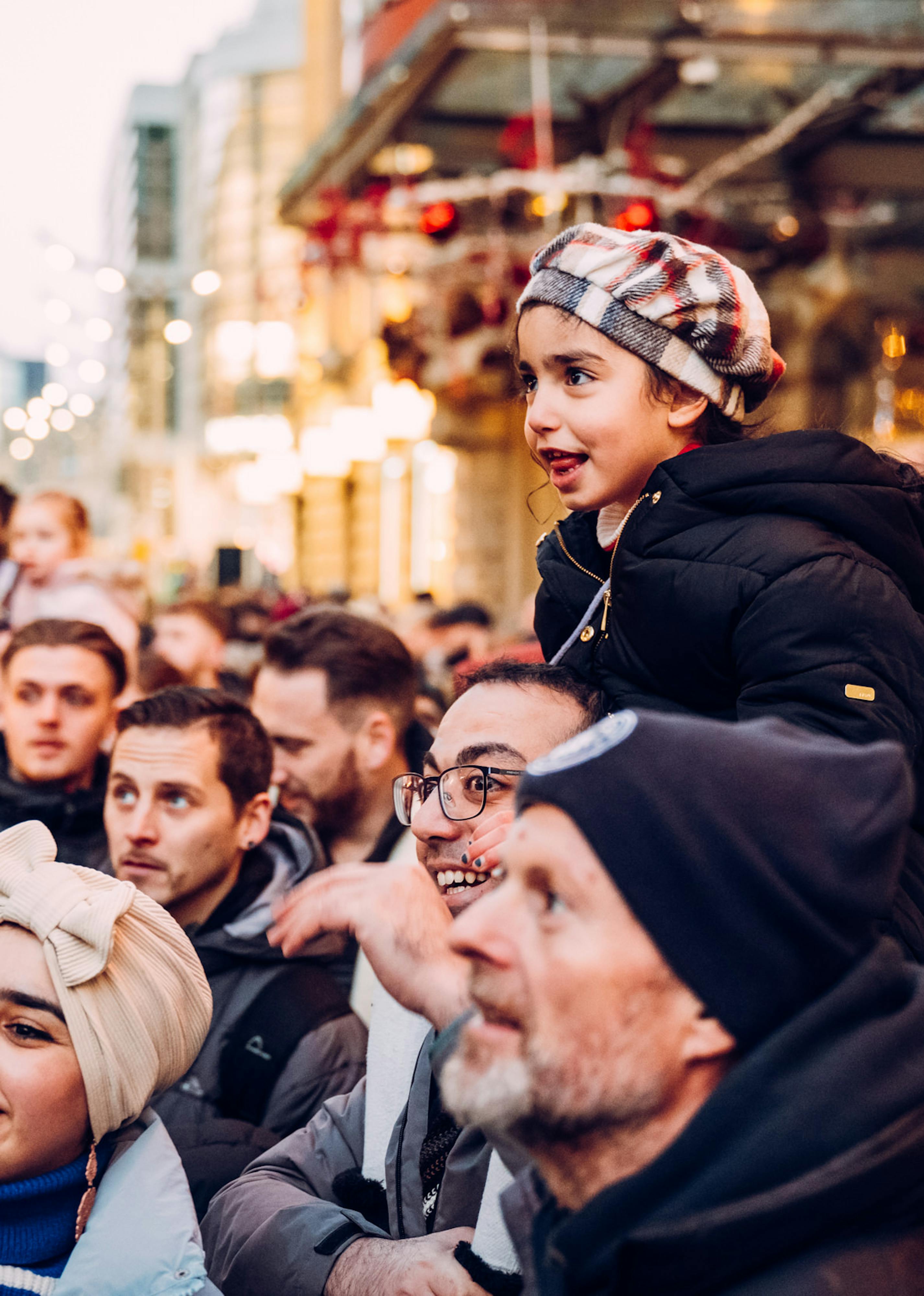 A crowd of people smiling at a performance