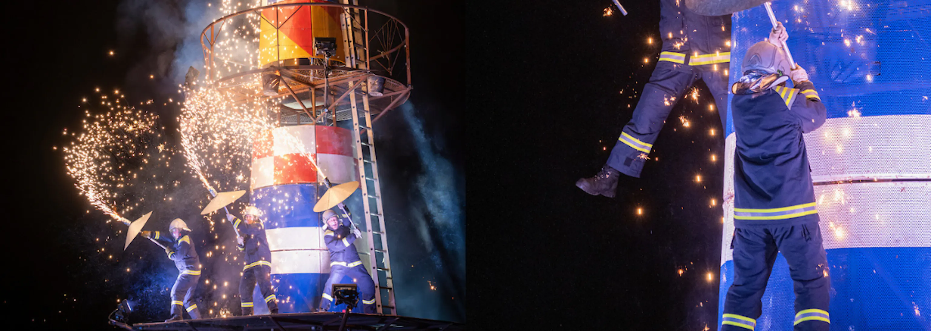 A large lighthouse structure with three lighthouse keeper performers on the structure with pyrotechnics