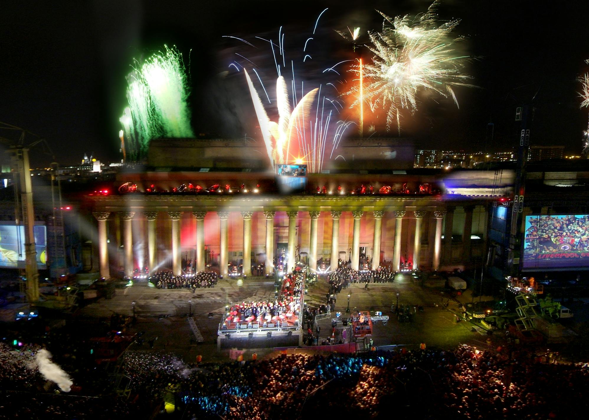 A audience of tens of thousands gathered in the city centre watching a performance with fireworks going off at night