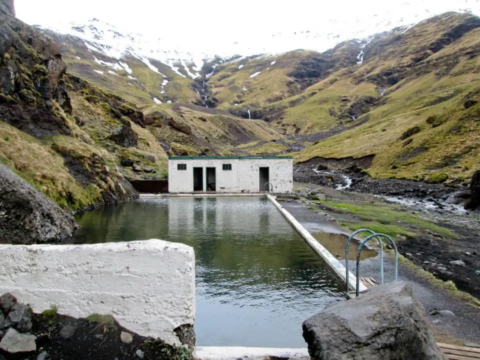 iceland's oldest swimming pool on the side of a moutain