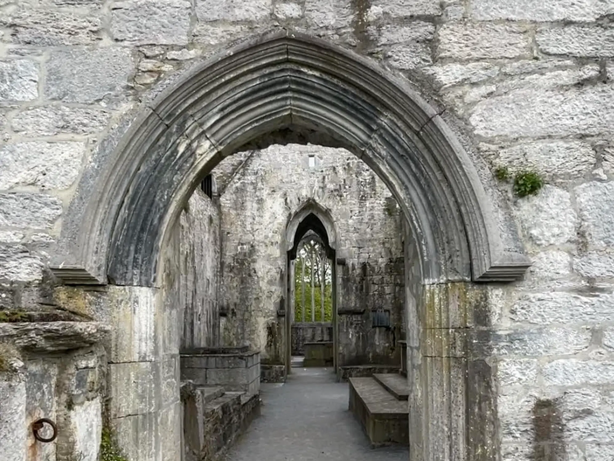 Archway of old abandoned abbey