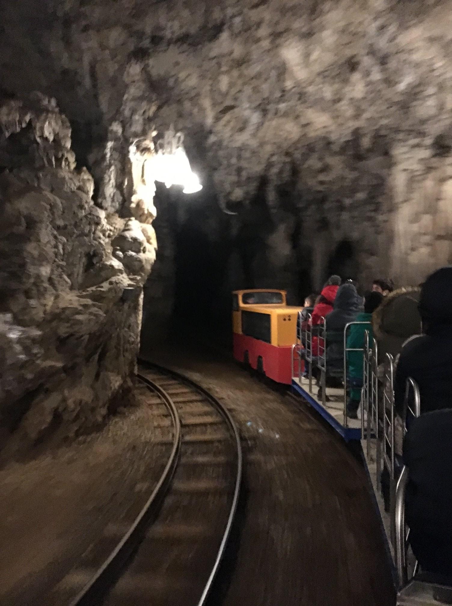 Mine cars on tracks driving through a mine