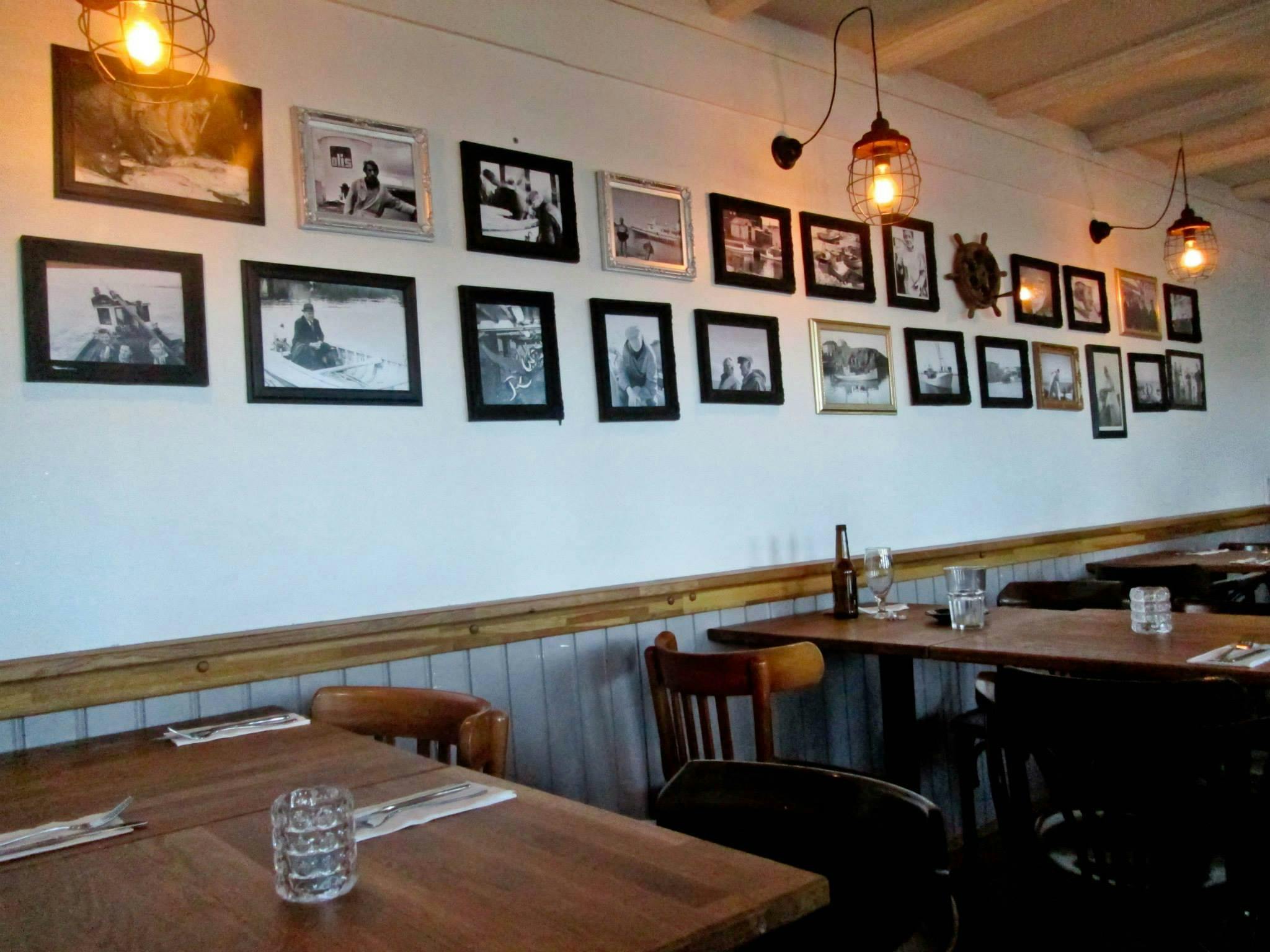 Photos on the wall inside restaurant