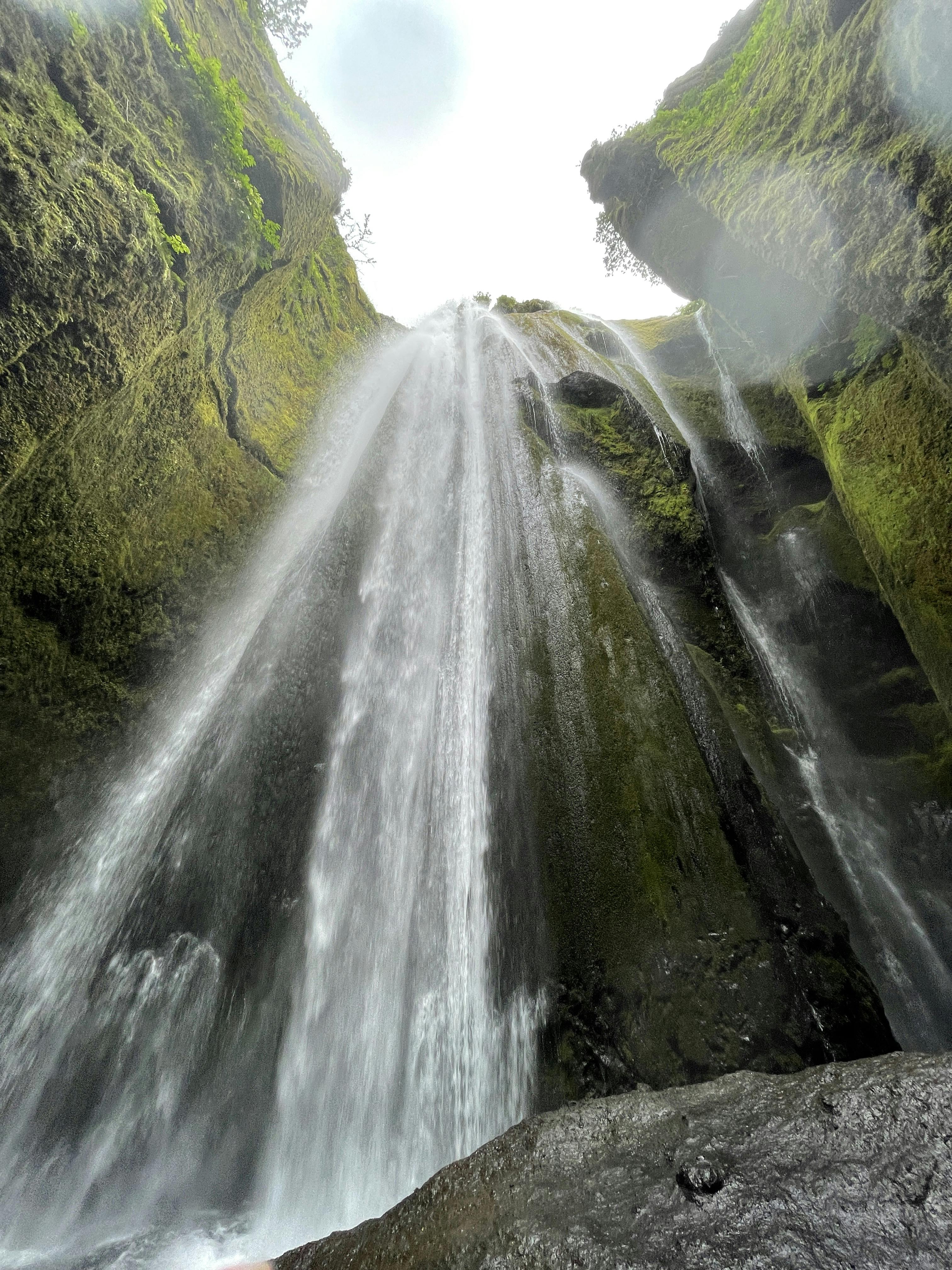 upward view of Gljúfrabúi Waterfall