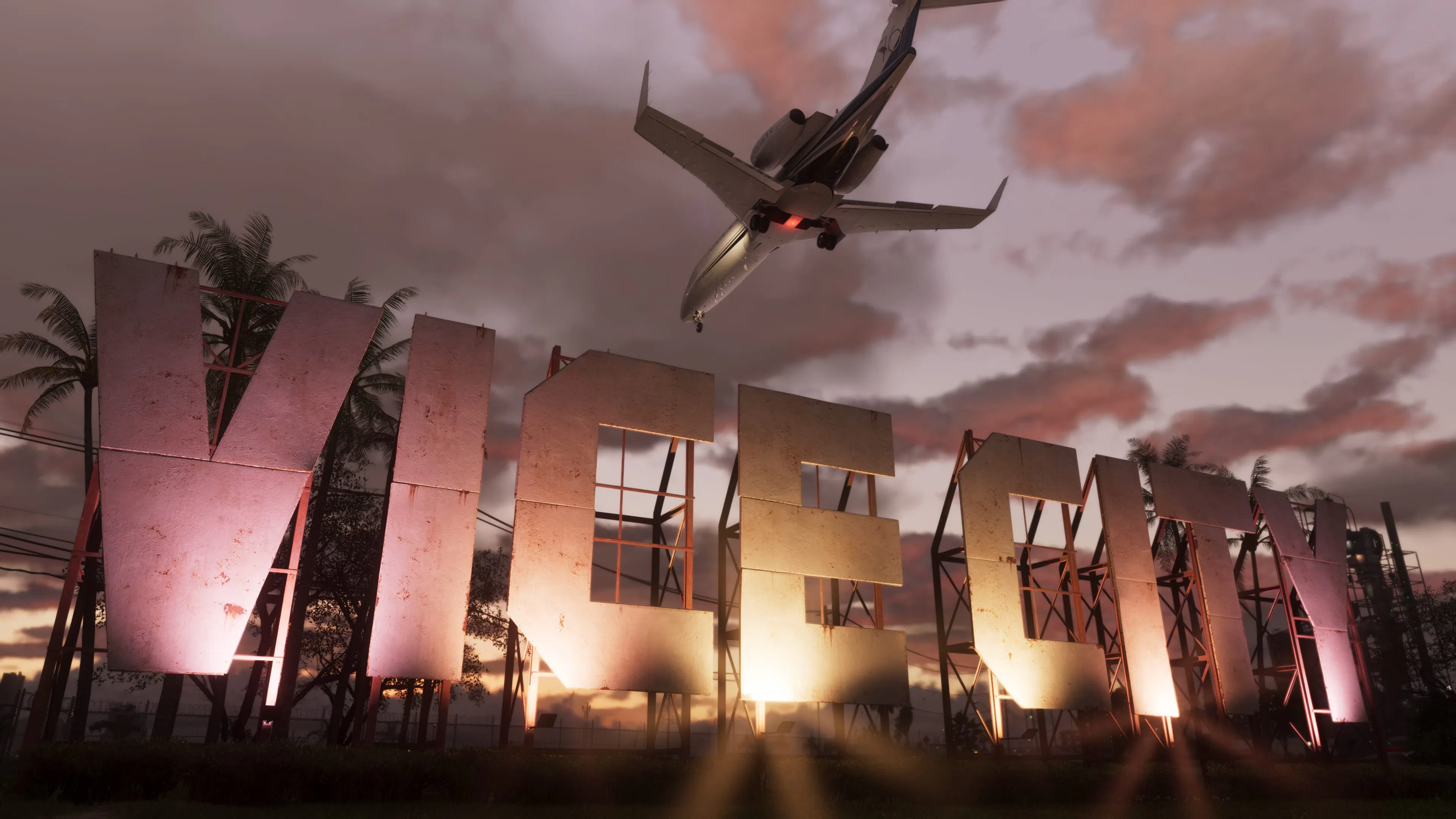 Les lettres Vice City sur une colline au coucher du soleil, survolées par un jet.