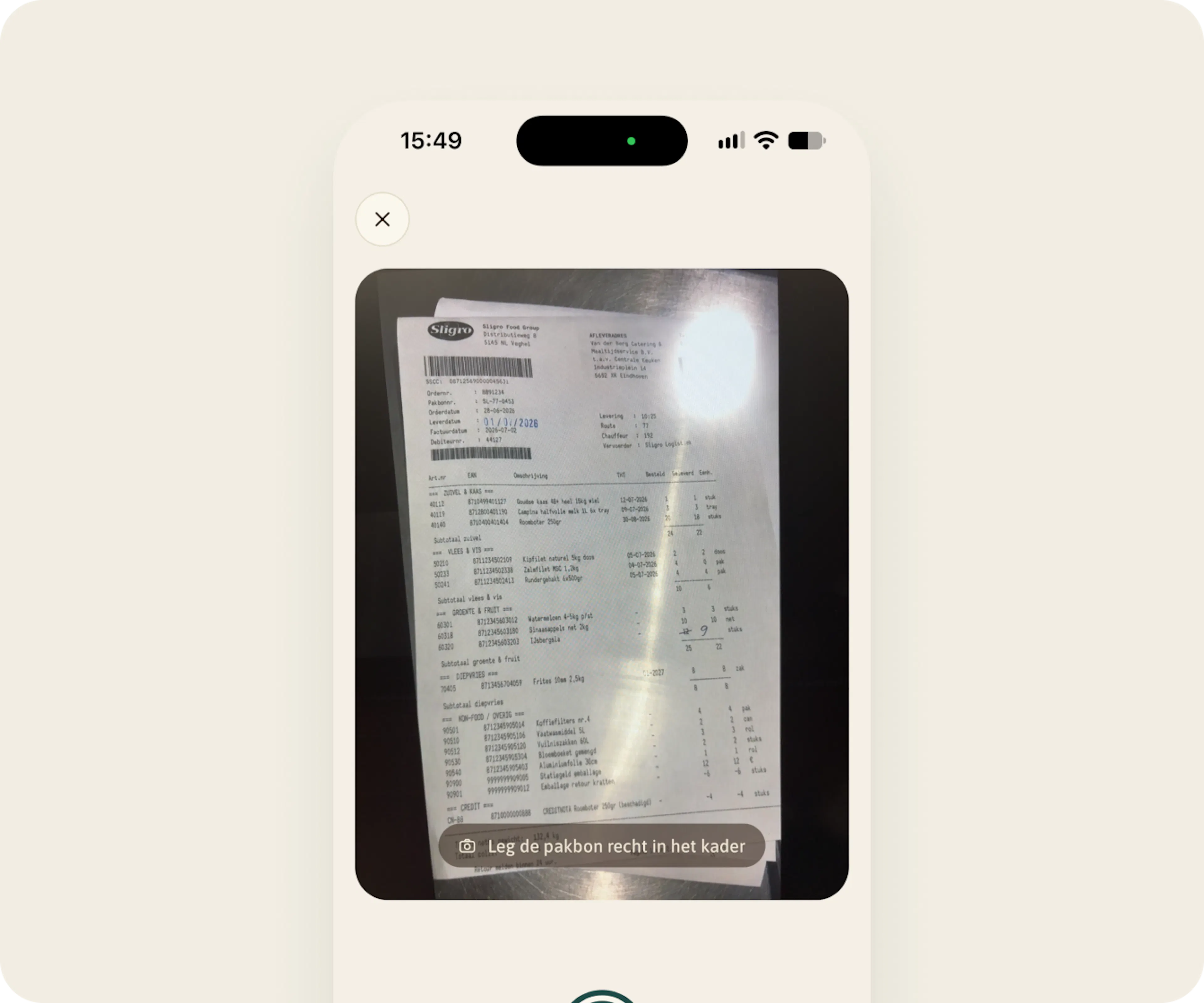 De Monitor-app met de camera op een pakbon en de aanwijzing Leg de pakbon recht in het kader.