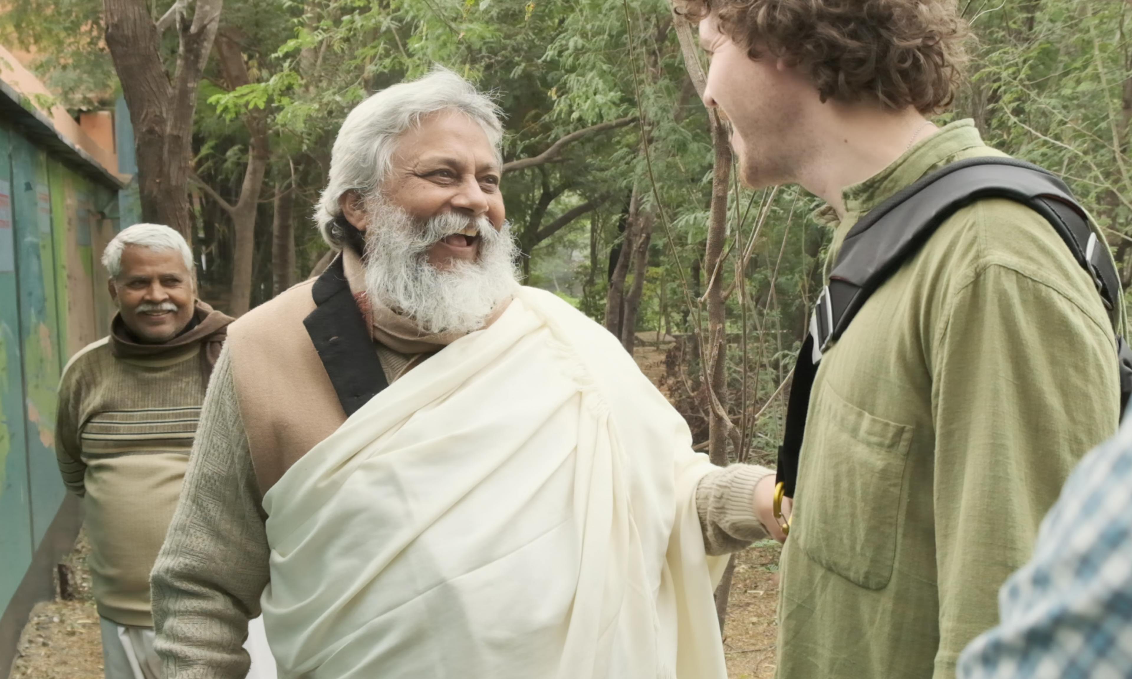 Rajendra Singh and Zach Weiss speaking with each other in India