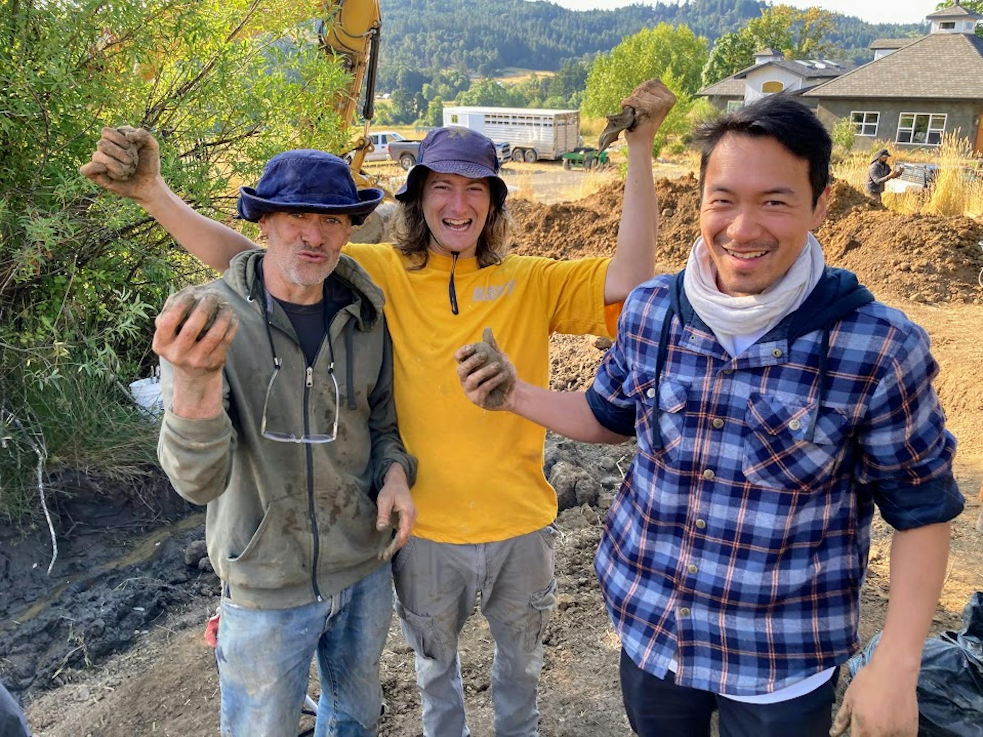 Students of the Water Stories Core Course stand dirty, happy, and proud of their achievements during an intensive workshop