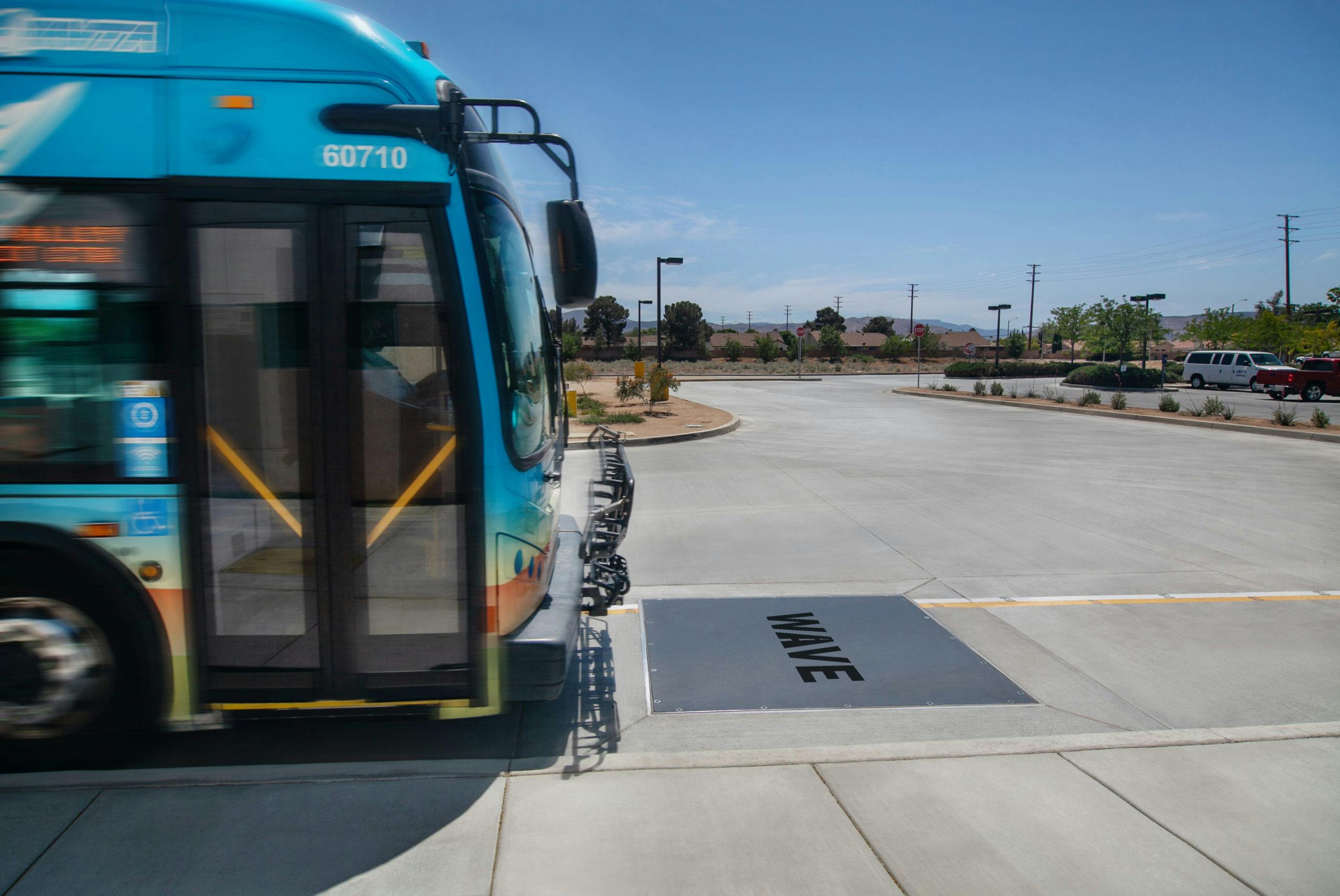 Transit bus driving over a wireless charging pad Transit bus driving over a wireless charging pad
