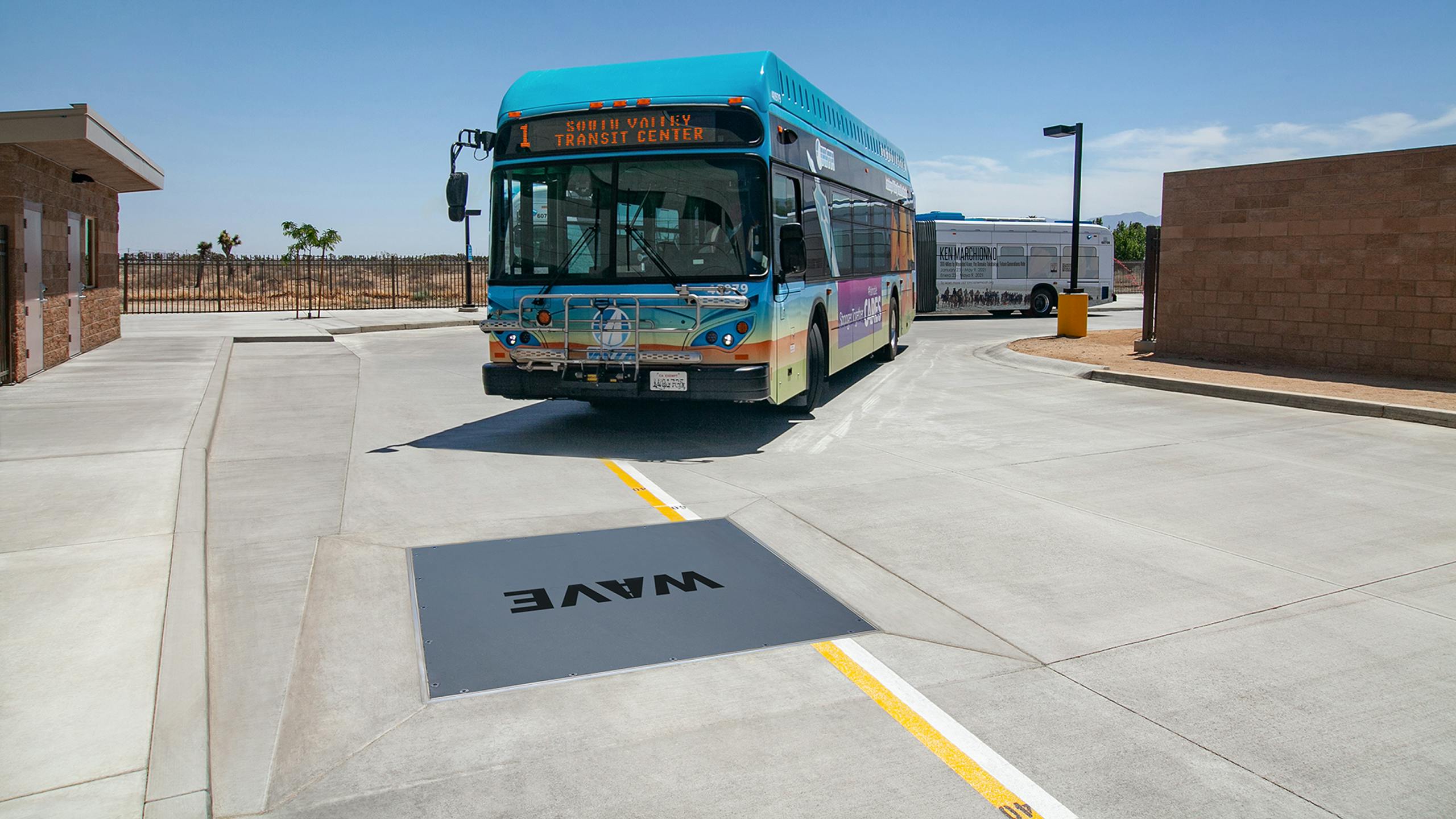 Power the Future of Fleet Charging WAVE wireless charging pad installed flush with pavement at a transit station