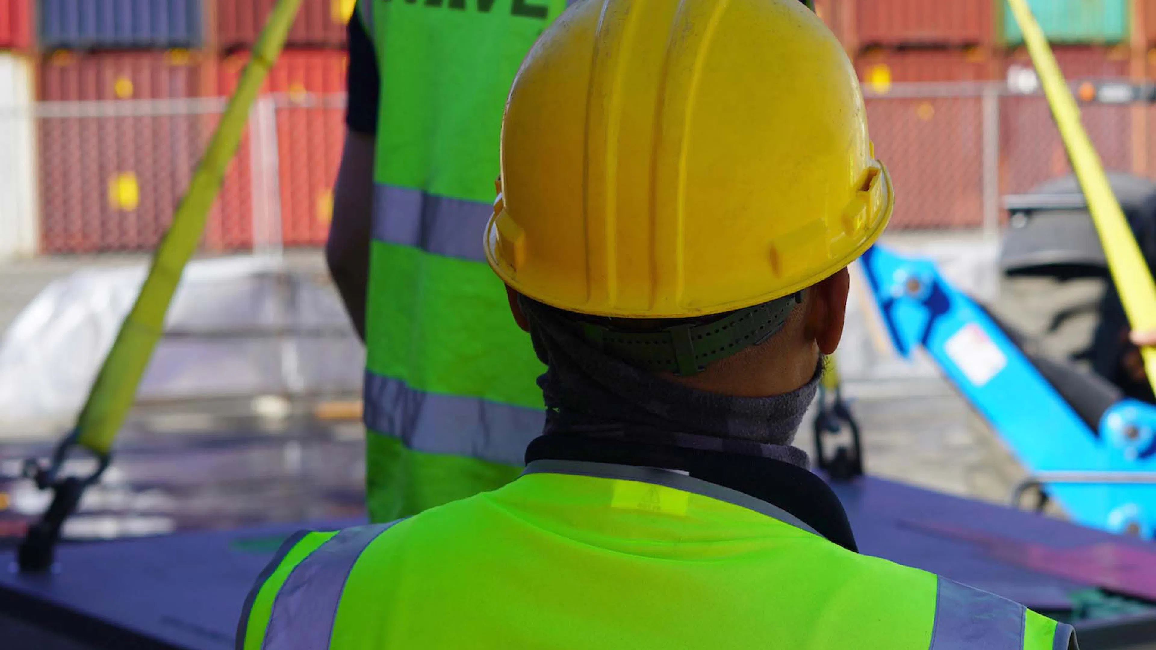 Construction workers installing a wireless charging pad Construction workers installing a wireless charging pad