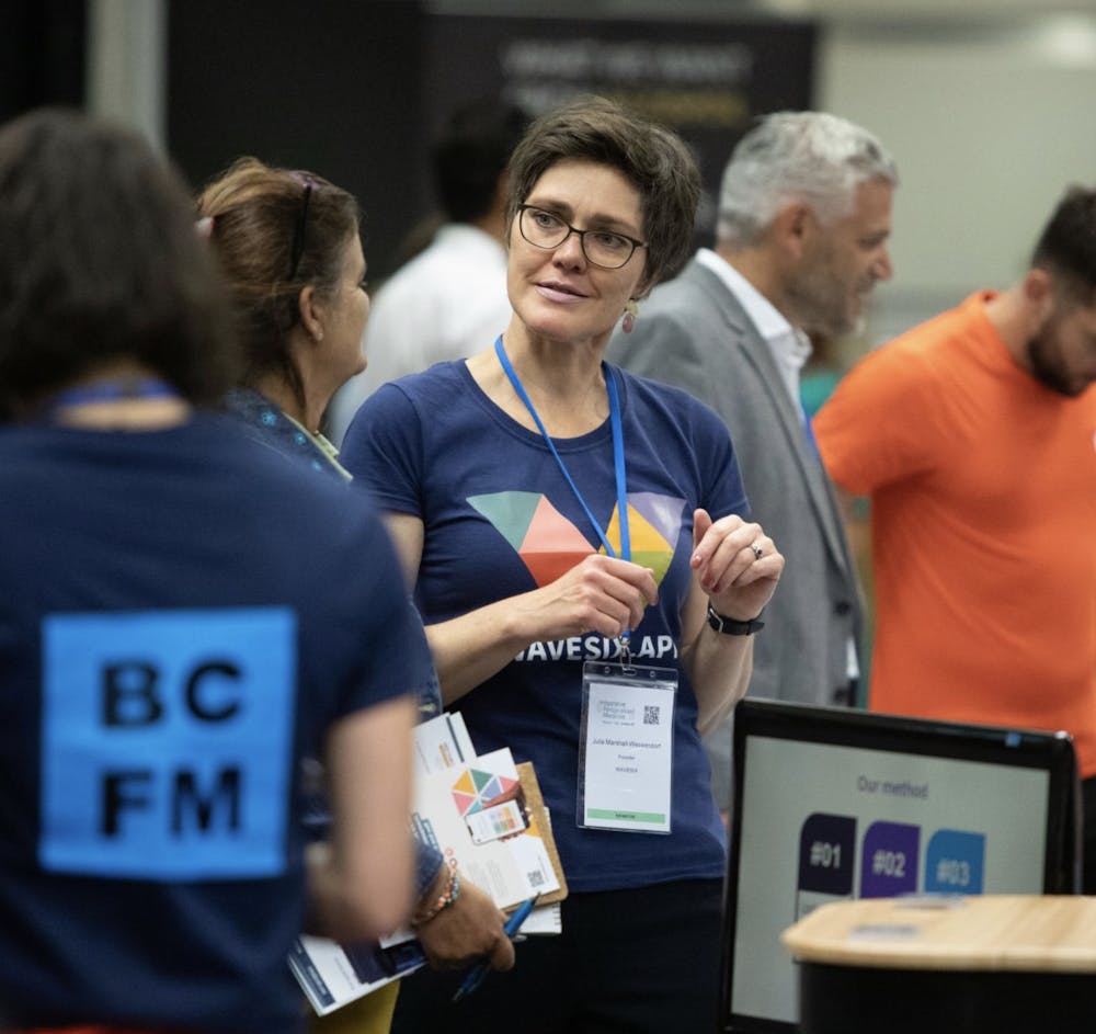 Julia at conference talking to another woman