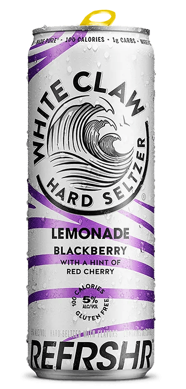A can of White Claw® REFRSHR™ Lemonade Blackberry sits on rocks in front of the sea.	