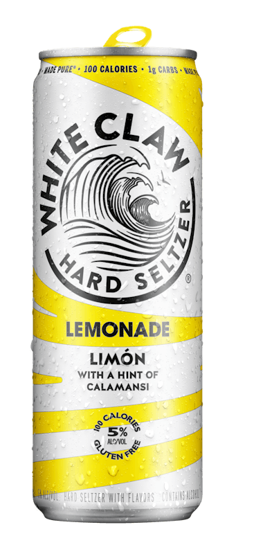 A can of White Claw® REFRSHR™ Lemonade Limón sits on rocks in front of the sea.