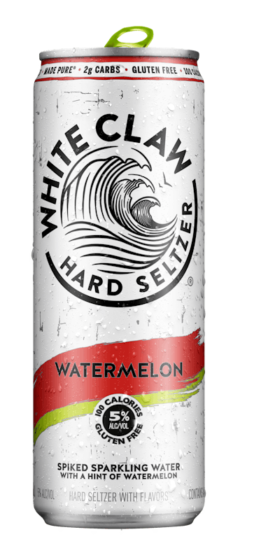 A can of White Claw® Hard Seltzer Watermelon sits on rocks in front of the sea.