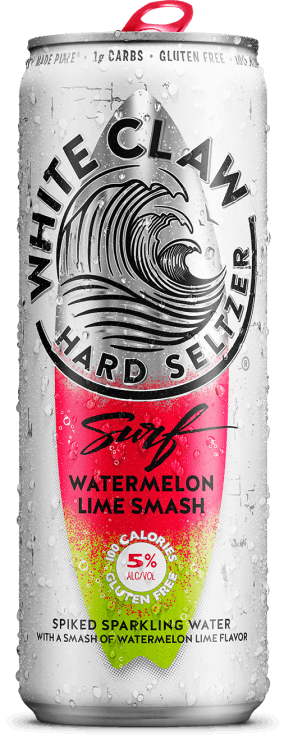 A can of White Claw® Surf Watermelon Lime sits on rocks in front of the sea.