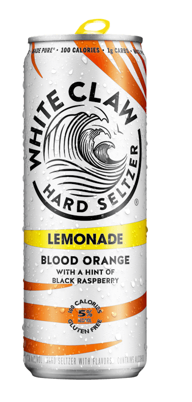 A can of White Claw® REFRSHR™ Lemonade Blood Orange sits on rocks in front of the sea.