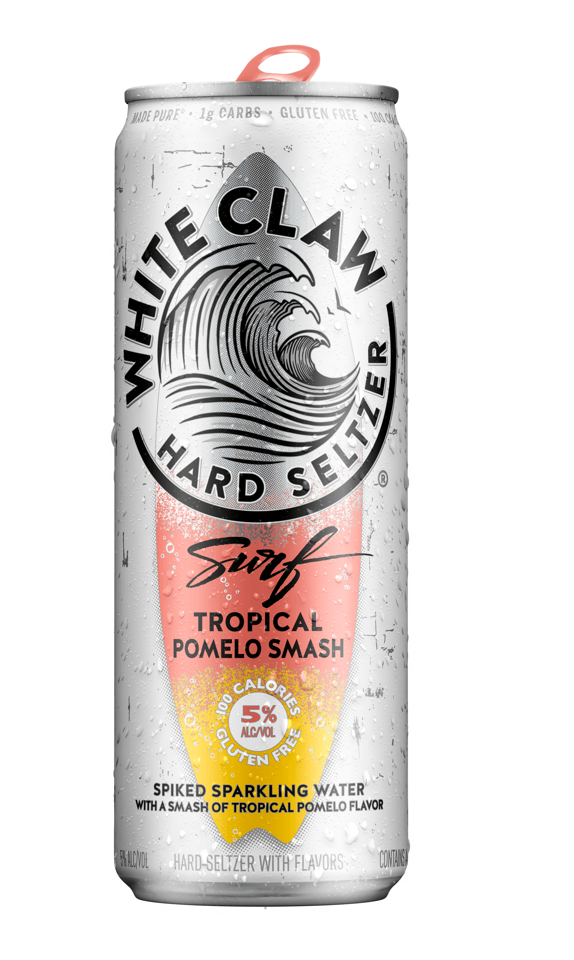 A can of White Claw® Surf Tropical Pomelo sits on rocks in front of the sea.
