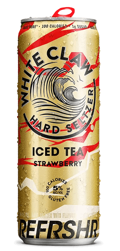 A can of White Claw® REFRSHR™ Iced Tea Strawberry sits on rocks in front of the sea.