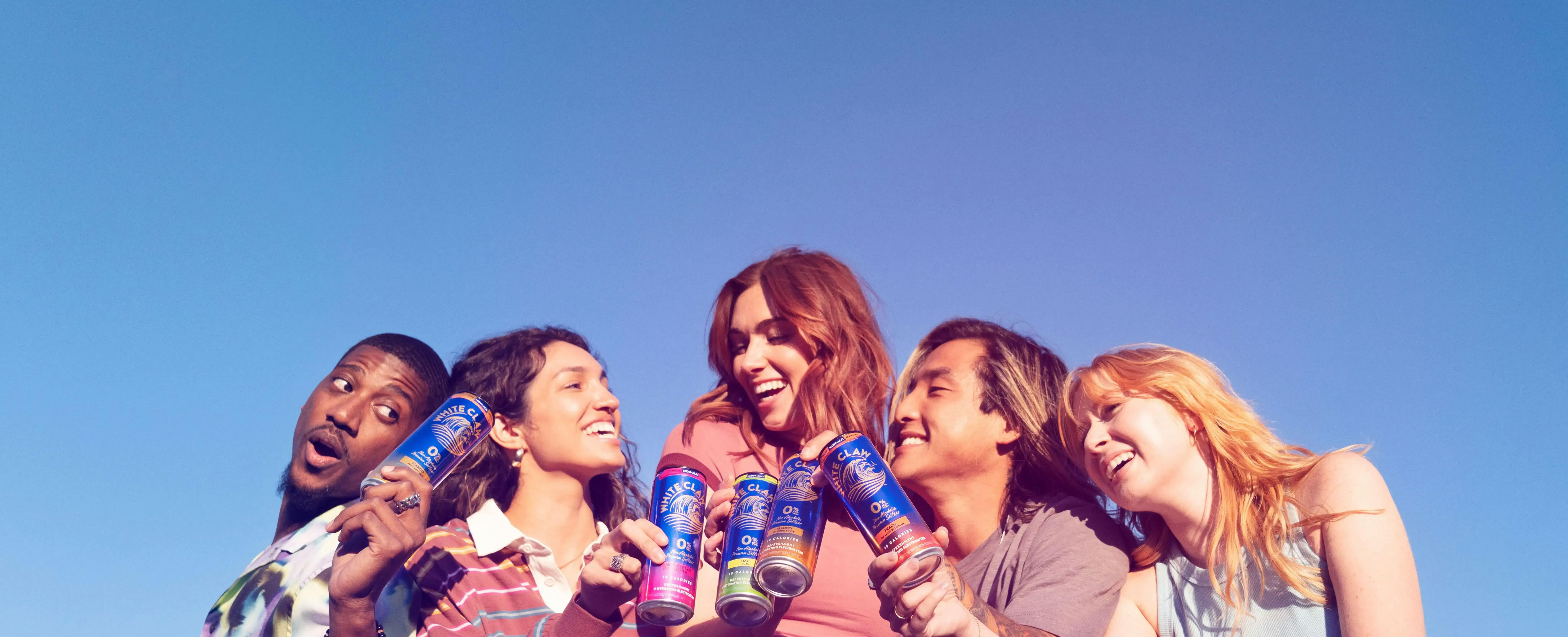 group of five people drinking white claw 0% alcohol 