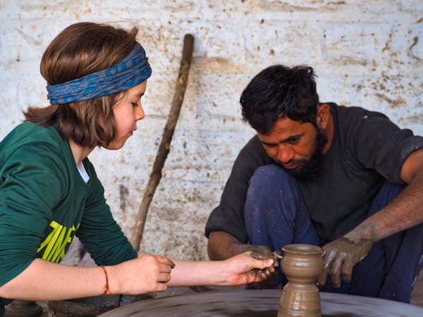 H learning the craft of pottery