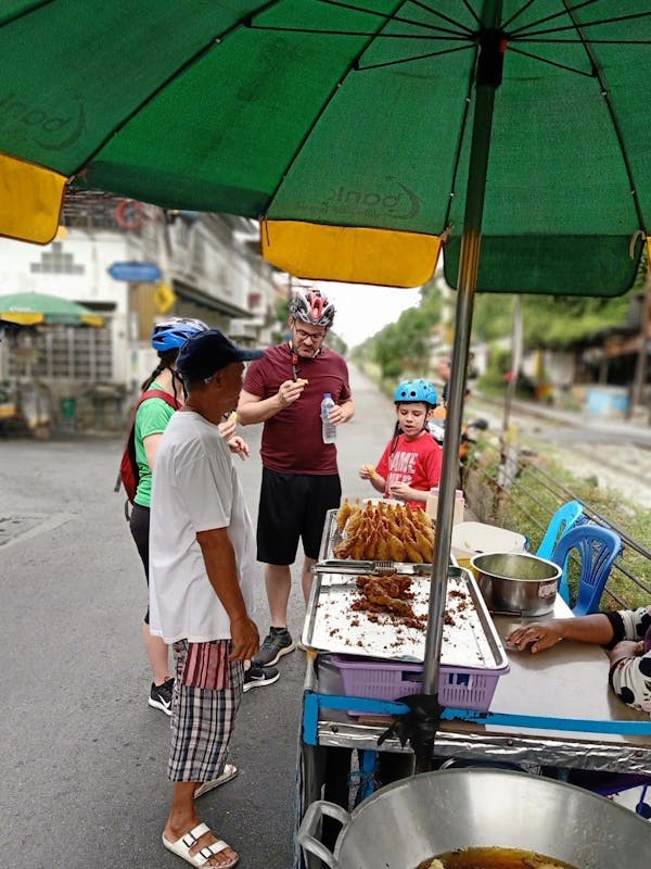 Eating a morning samosa on our bike adventure