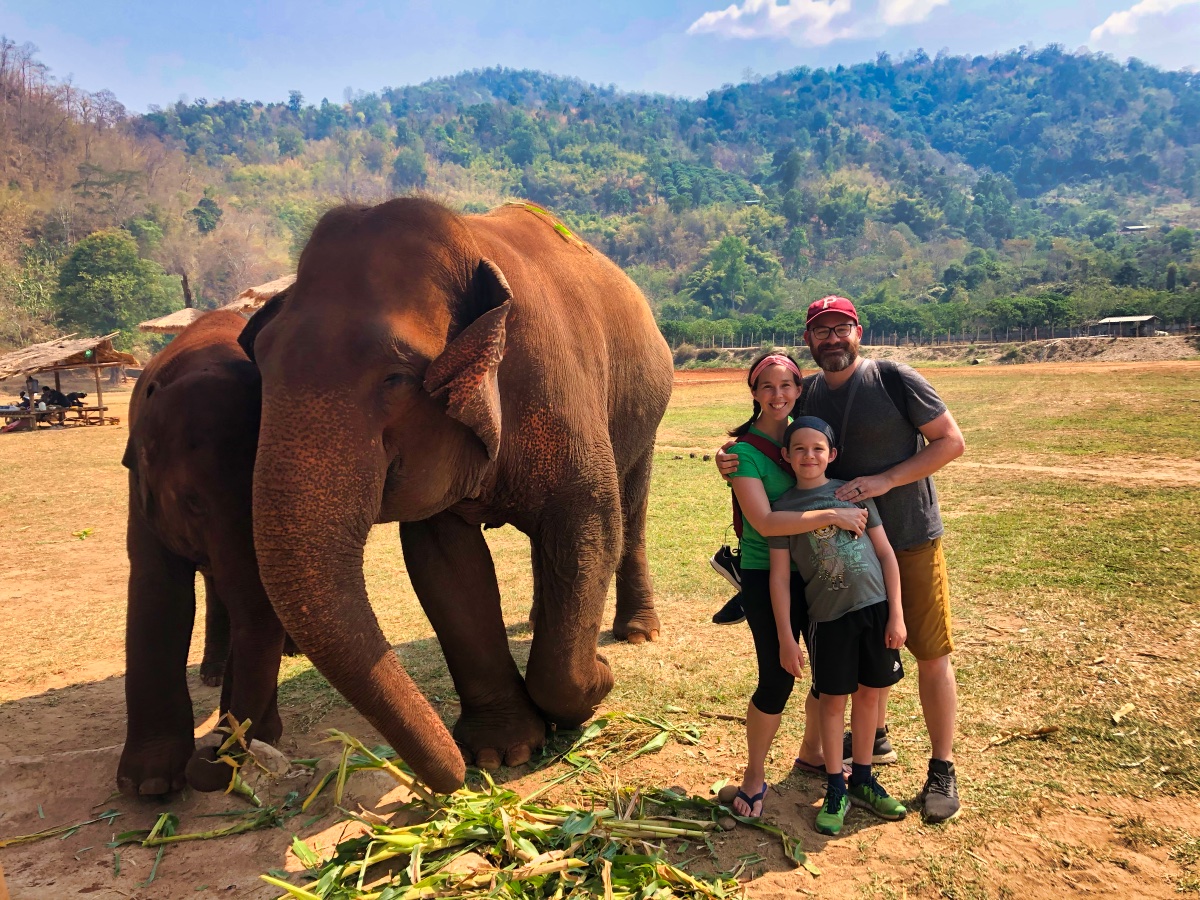 Family next to an elephant