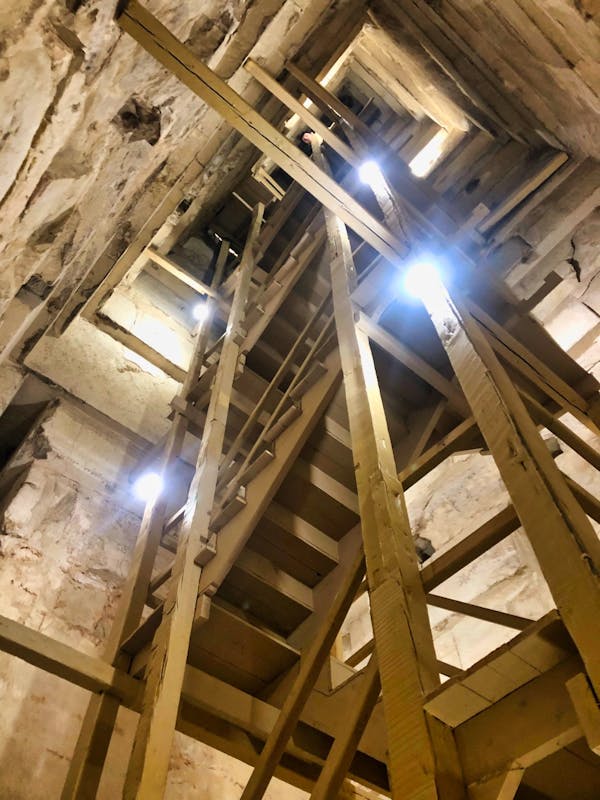 In first chamber, the bottom of the staircase