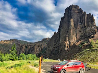 Car in front of a vista