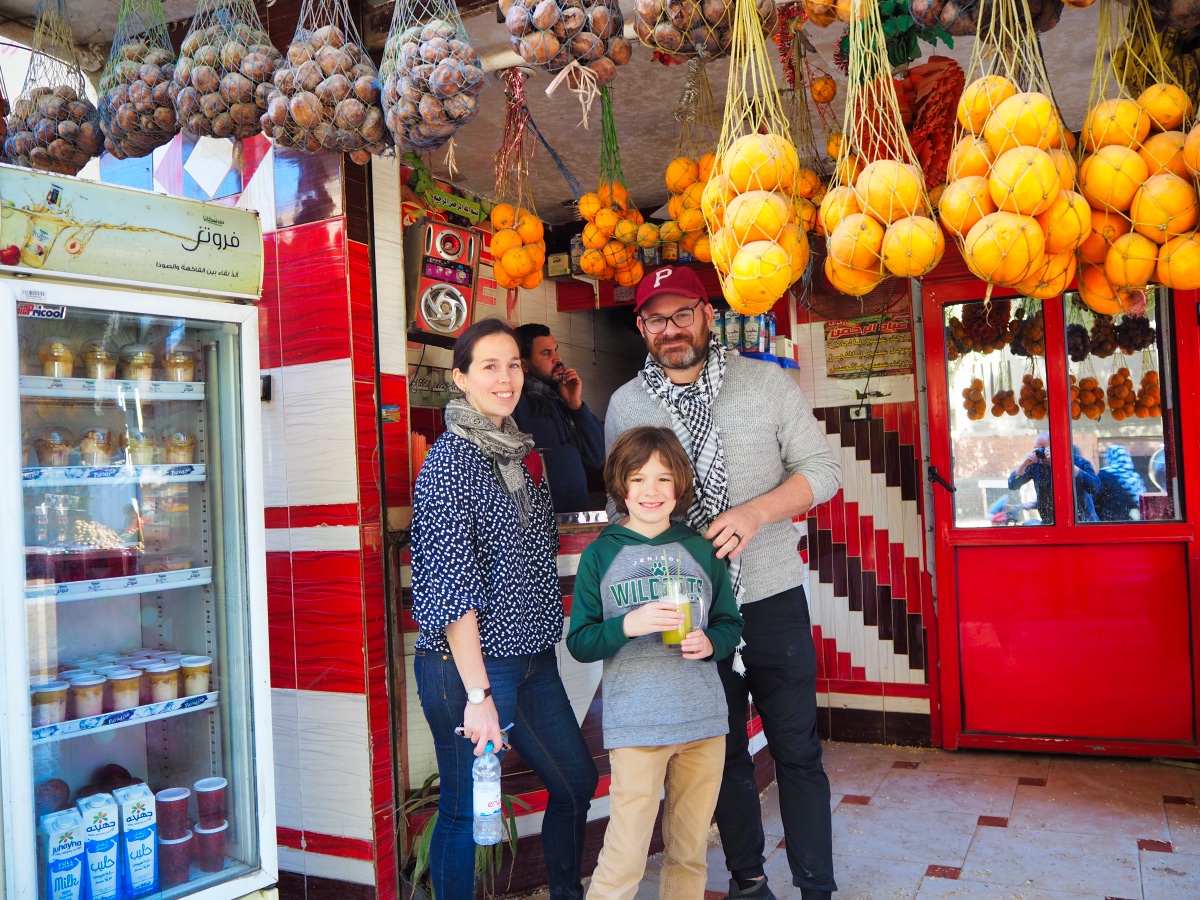 Laura, Jon, and H stopping for some sugar cane juice
