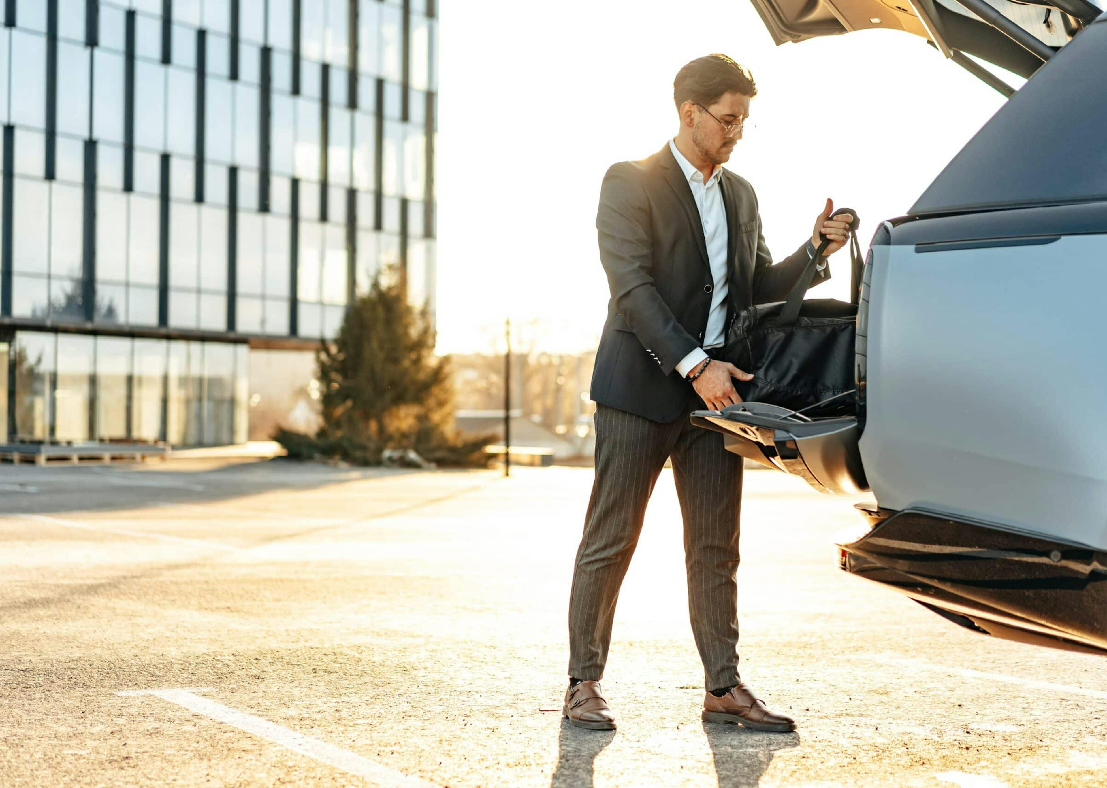 A high earning individual all packed up leaving from his high earning job