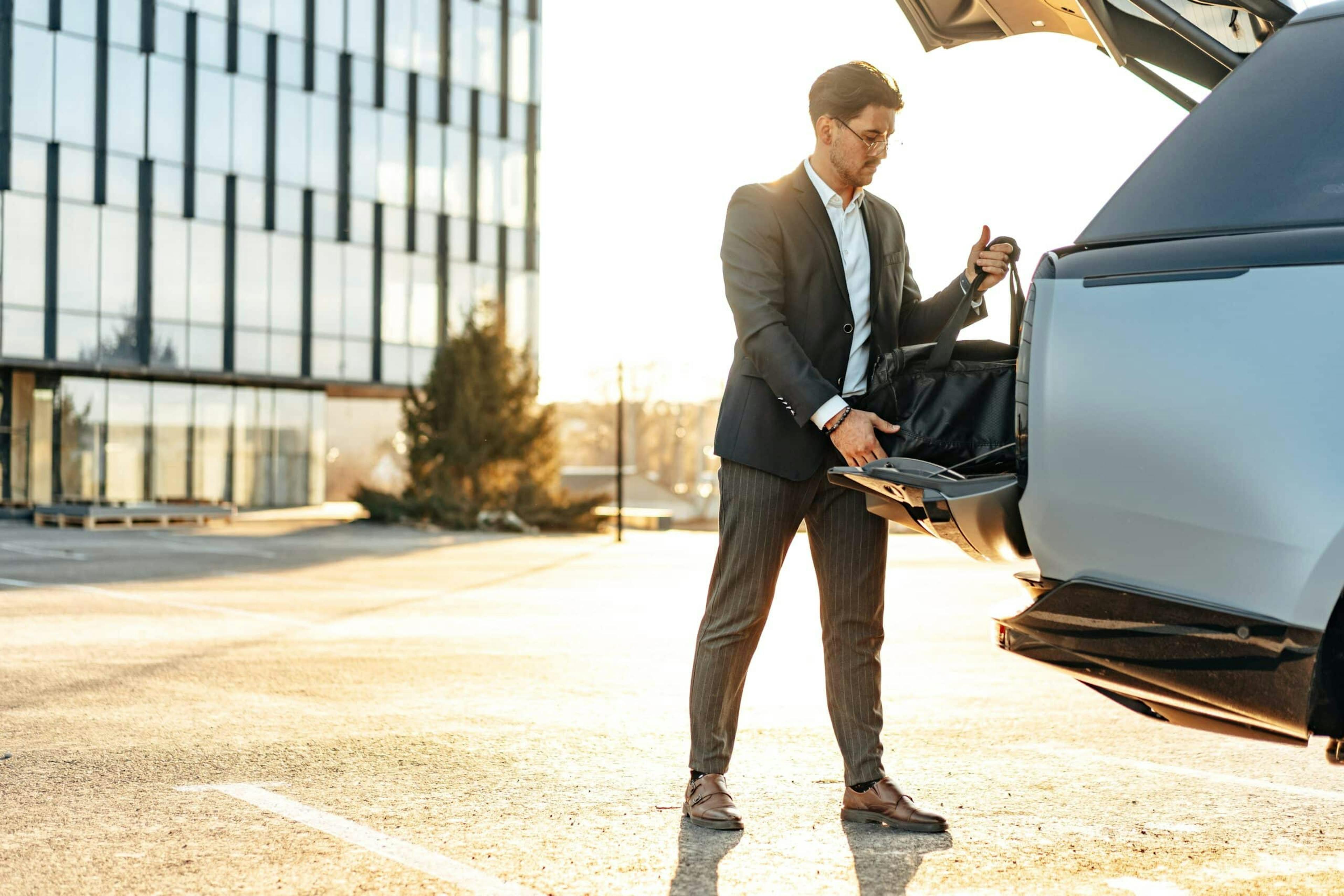 A high earning individual all packed up leaving from his high earning job