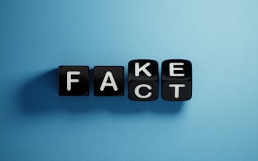 letters are spelling out word the word fact to debunk credit myths